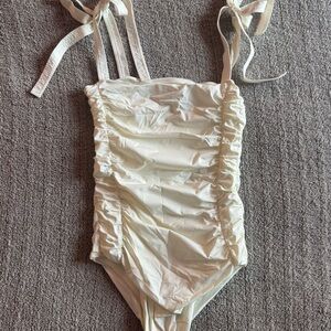 Johanna Ortiz cream ruched one piece bikini